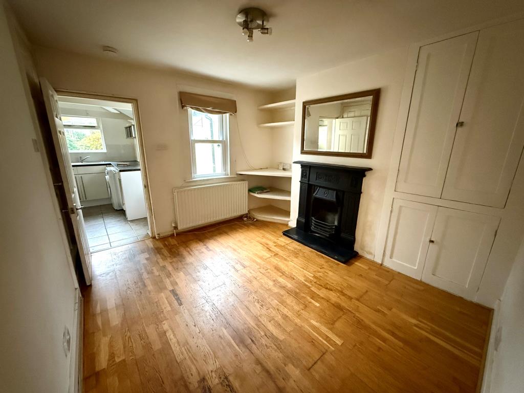 Lot: 110 - END-TERRACE HOUSE WITH OFF ROAD PARKING - Dining room with access to basement